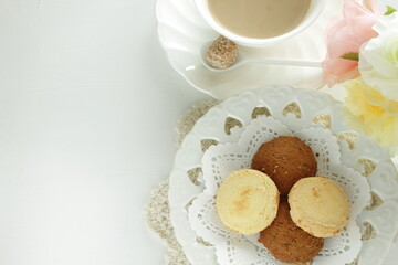 Obraz na płótnie Canvas Homemade coffee and vanilla cookie with flower