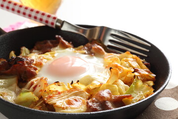 Korean food, cabbage and pork stir fried with egg