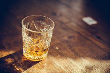 Whisky glass on a wooden surface
