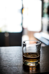 Whisky glass on a wooden surface