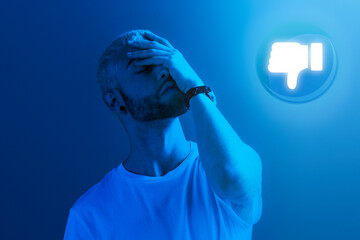 Sad man getting dislikes by audience for social addiction ad