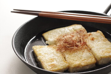 Japanese food, pan fried tofu and Katsuobushi in skillet pan