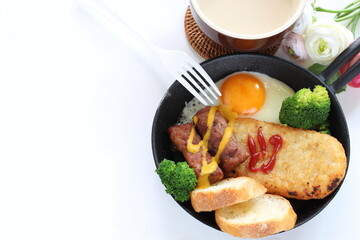 hashed brown and sausage with sunny side up fried egg for gourmet breakfast