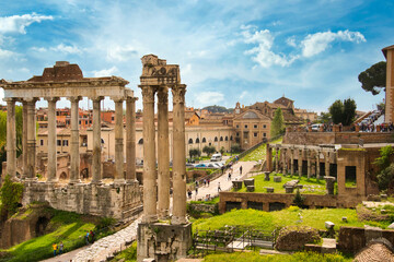 Fototapeta premium forum romanum in Rome, Italy. Temple of Saturn and Temple of Castor and Pollux, ancient ruins of the Roman Forum. Travel and vacation in Italy