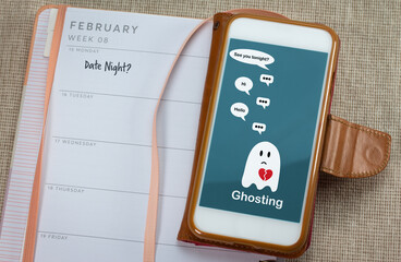 Ghosting on mobile phone on table with diary, Ghosted to cut all communication without explanation,...