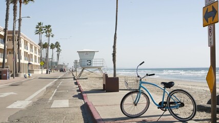Blue bicycle, cruiser bike by ocean beach, pacific coast, Oceanside California USA. Summertime...