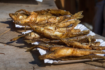 Fried fish on paper plates