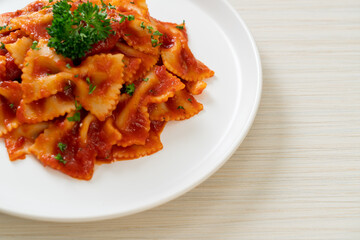 farfalle pasta in tomato sauce with parsley
