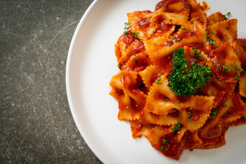 farfalle pasta in tomato sauce with parsley