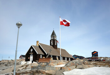 The Greenland flag is hoisted.