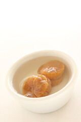 Chinese gourmet food ingredient, dried scallop soaked in water with copy space 