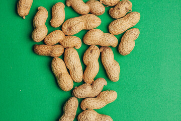 peanuts in shells snack Green background snack for alcohol