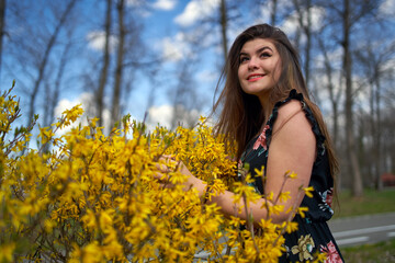 Young woman in the spring in park