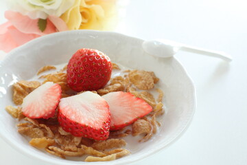 freshness sliced strawberries and corn flakes