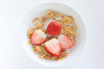 freshness sliced strawberries and corn flakes