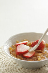 freshness sliced strawberries and corn flakes