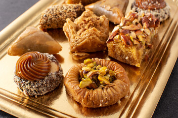 Assortment of Ramadan dessert baklava on black background
