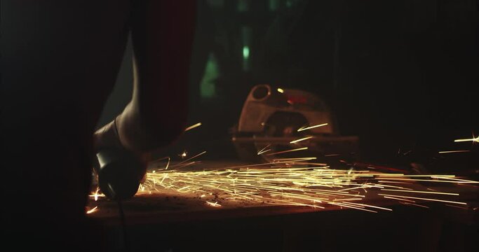 Man working with a flex in his garage.