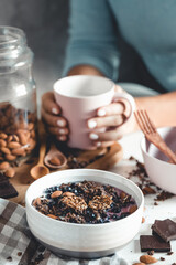 Fruit plate with granola. Exotic fruits. Woman healthy breakfast