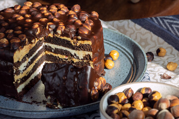 Homemade cold chocolate cake with hazelnuts, chocolate dessert background
