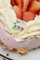 Mothers Day heart cake with whipped cream and strawberry