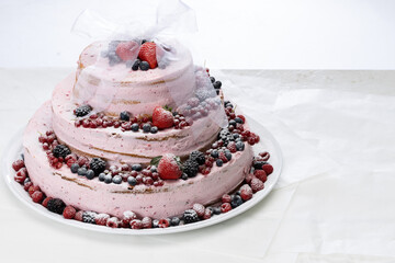Obraz na płótnie Canvas Pink Wedding Naked Cake with mixed Berry and Strawberry