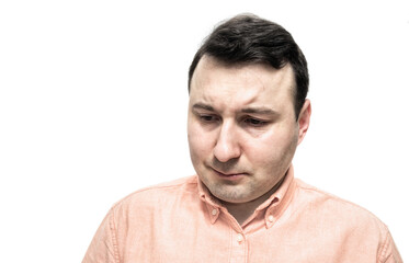 Portrait of a sad man on a white background. Mental health concept.