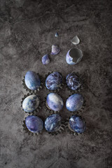 blue marble eggs on a stone background. Easter eggs are painted with natural blueberry dye.