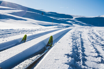 Close up of a cross country skiing slope in the artic mountains on a cold sunny day.
