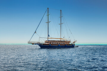 Fototapeta na wymiar Luxury sail yacht in cruise on tropical sea in summer time, Red Sea, Egypt