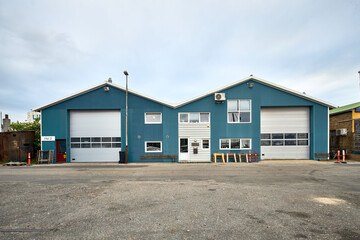 Fototapeta na wymiar a large blue warehouse exterior in scandinavia