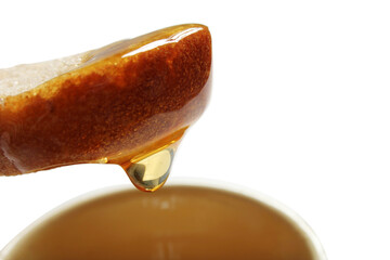 Honey and slice of bread.