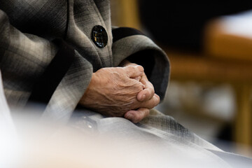 Folded hands of an old woman. Elderly man's wrinkled hands