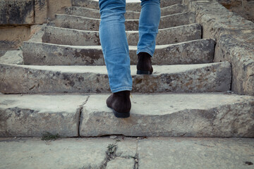 Stylish Businessman Legs Leisure Walking Up On Stairs On Vacation Holiday In Summer Day.Man Feet Wearing Pants And Shoes Walking Up Stair.Stylish Businessman Resting Walks Up On Steps On City Street.