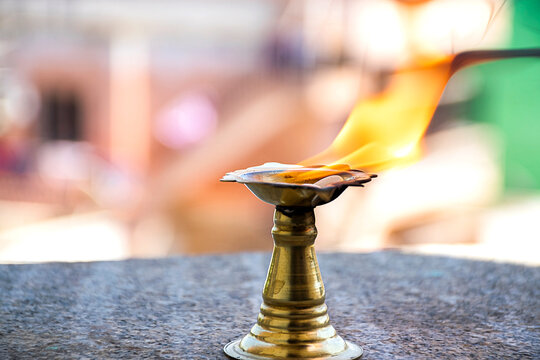 Stock photo of burning camphor kept in camphor holder camphor for presenting rituals at Bangalore Karnataka India.