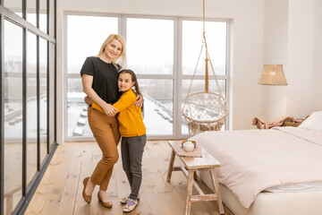 Mother smiling with her daughter