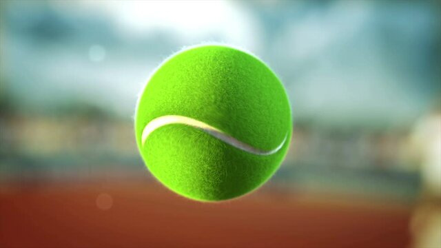 Tennis racket hitting tennis ball in slow mo close-up, on a sunny day, on a tennis court