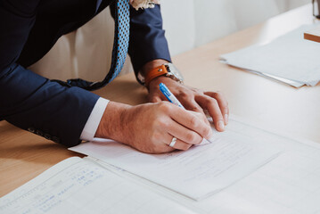 person signing a contract