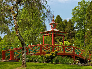  The colourful Chinese Bridge in the parkland over the lake at Apremont in the Loire Valley France