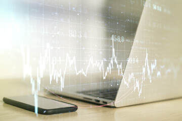 Double exposure of abstract creative financial chart on modern laptop background, research and strategy concept