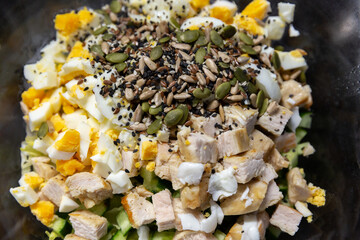Chicken salad, eggs, cucumber, iceberg lettuce leaves, super food seeds