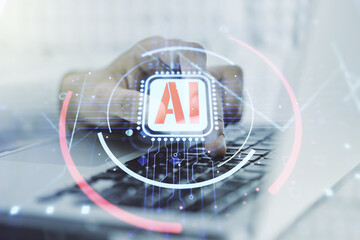 Double exposure of creative artificial Intelligence abbreviation with hand typing on computer...