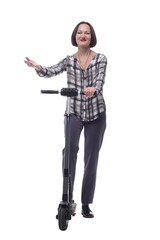 attractive mature woman with electric scooter. isolated on a white background.