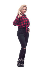 smiling young woman in a checkered shirt making an OK gesture