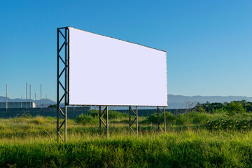 advertising panel in an area with vegetation. billboard