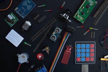 various microcircuits, controllers, sensors, parts, motherboard, cable, wires and a soldering iron...