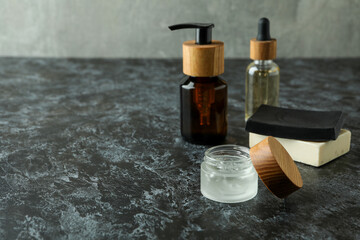 Obraz na płótnie Canvas Concept of men's hygiene tools on black smokey table
