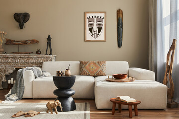 Stylish ethnic living room interior with design sofa, wooden stool, moroccan shelf, carpet decor, a...