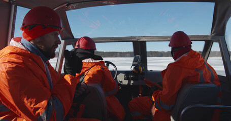 Professional lifesaving team sailing air-boat in arctic © TommyStockProject