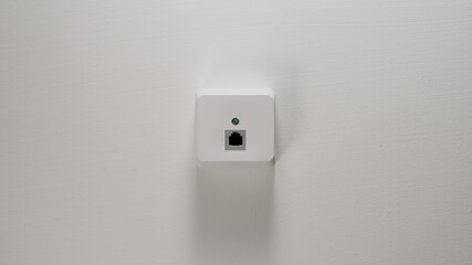 Internet Socket on a white wall